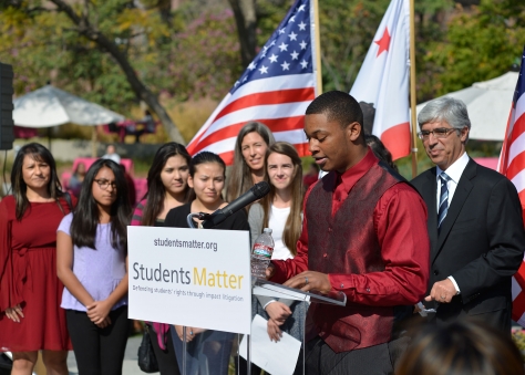 The Vergara Nine surrounded by handlers.
